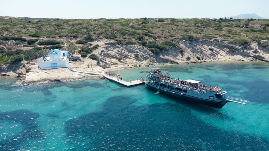 The Kos Pearl moored at the chapel jetty over turquoise water on the Kos day cruise.
